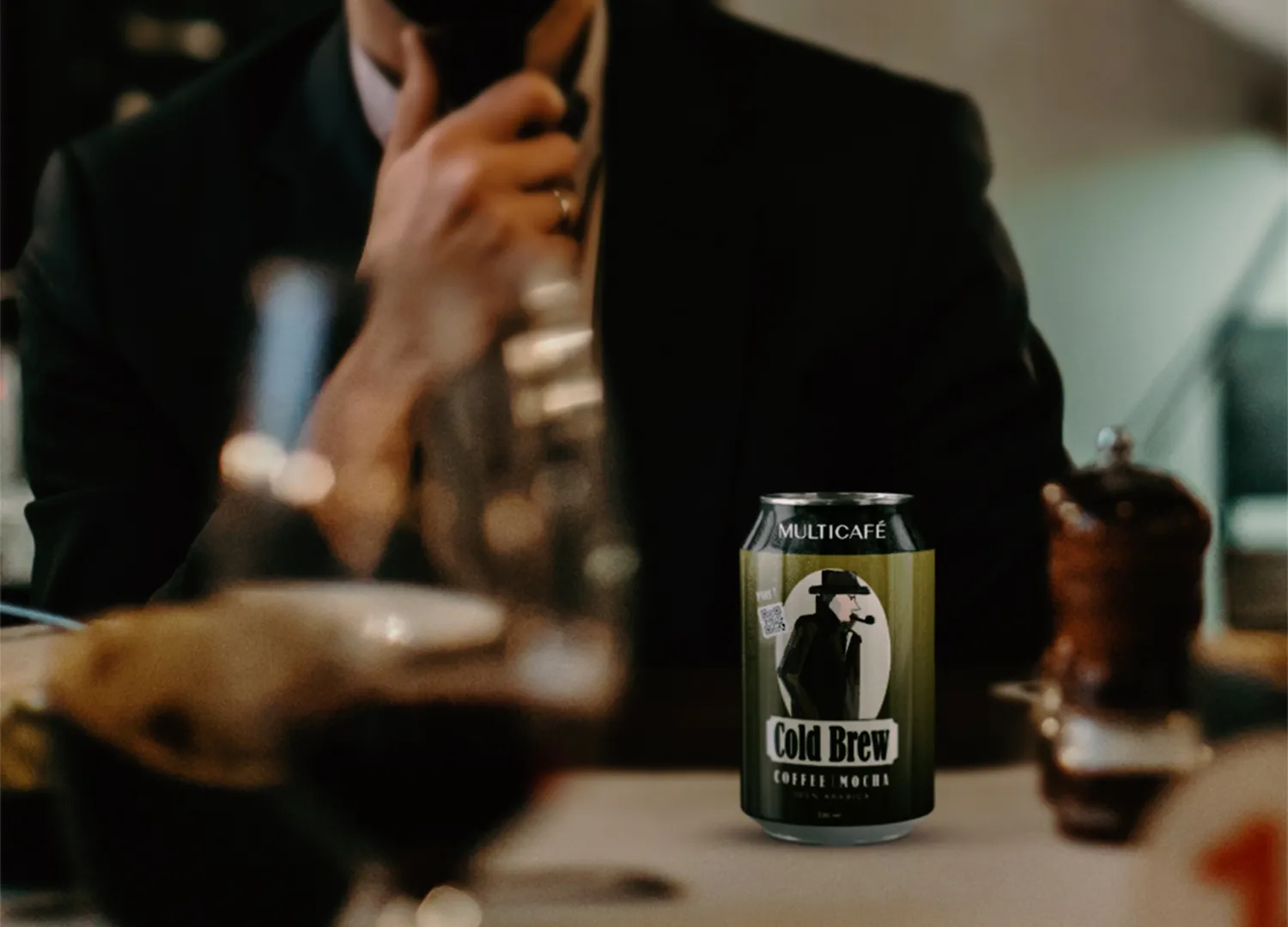 Multicafe cold brew cans in a café